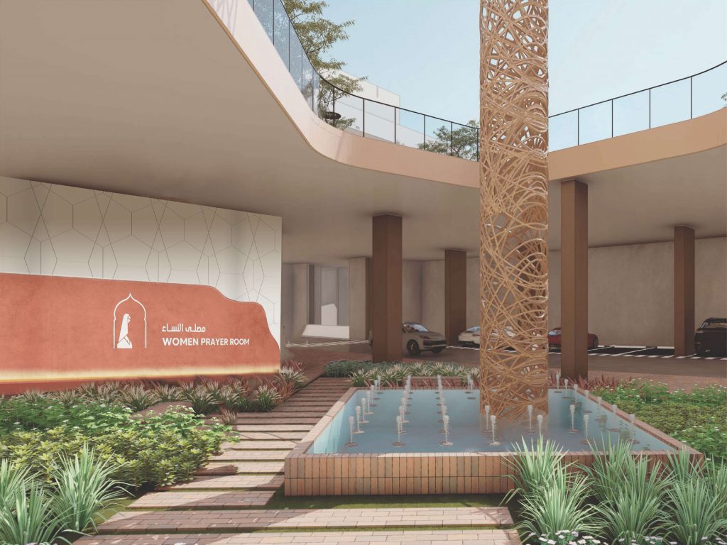 Photograph of a building's courtyard area (with water feature), with signage for the women's prayer room (designed by Xotox Branding)