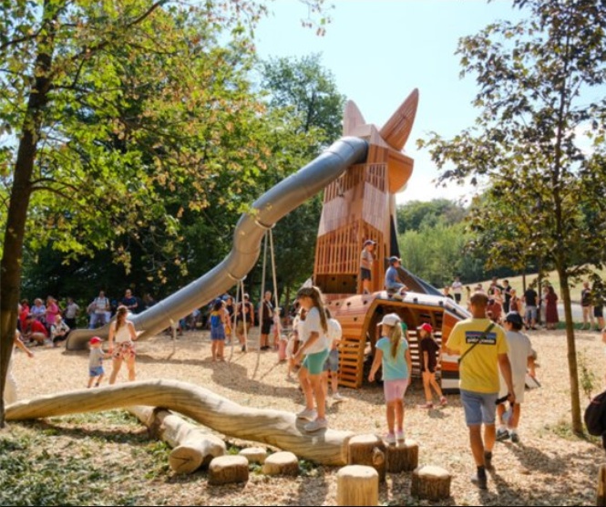 Children playing outside in a playground, on a bright summer's day