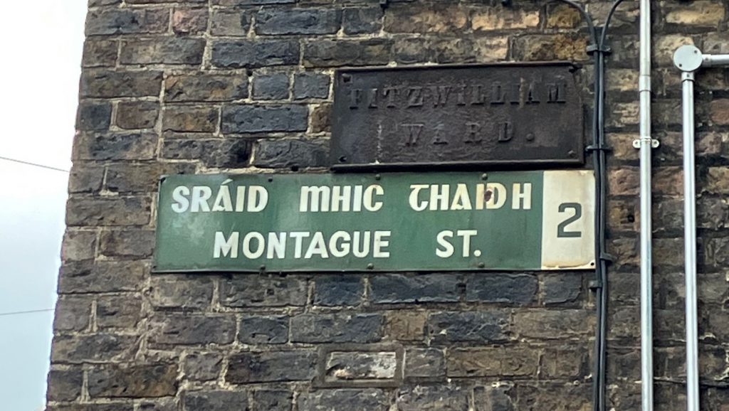 Example of street signage in Dublin, Ireland, showing road name (Montague Street) in Irish and English