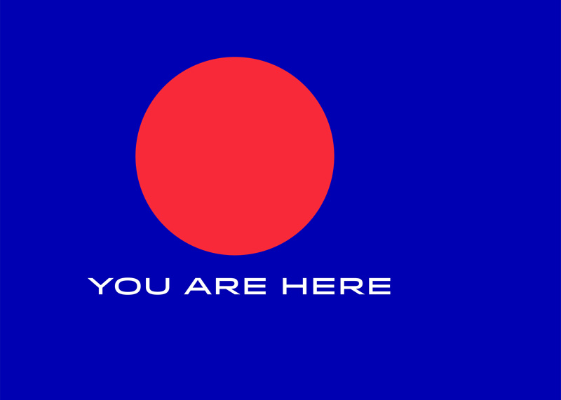 Red dot on a mid-blue background with 'You are here' positioned below the red dot