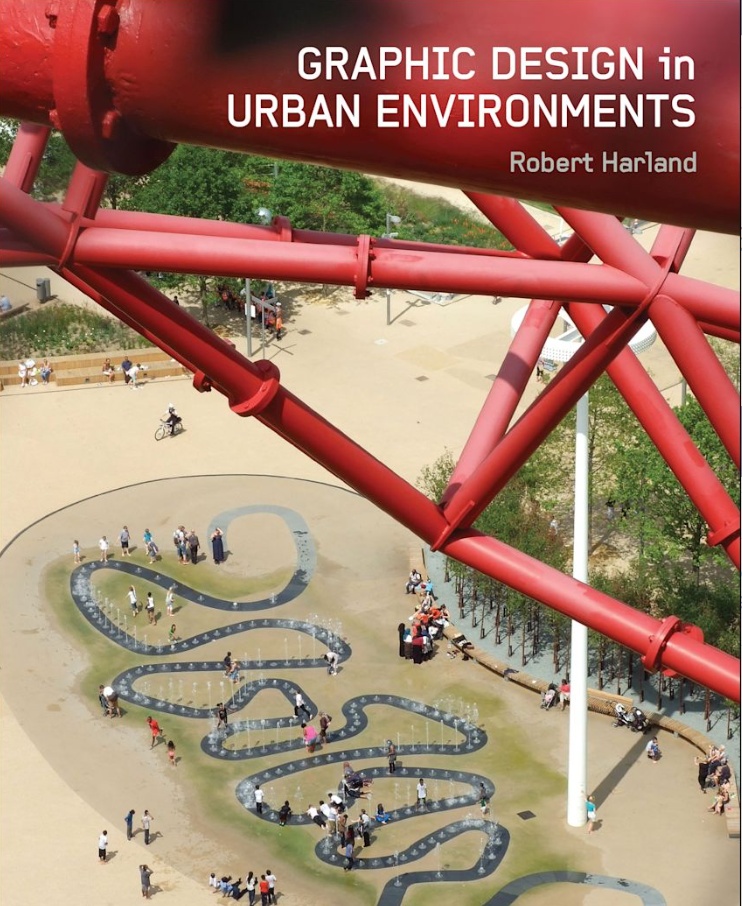 Cover of the book Graphic Design in Urban Environments by Robert Harland. The image shows an aerial view of a public plaza with curving water features and people gathered around them. A large red architectural structure cuts across the foreground, framing the urban scene and highlighting the relationship between graphic design, public space, and city environments.
