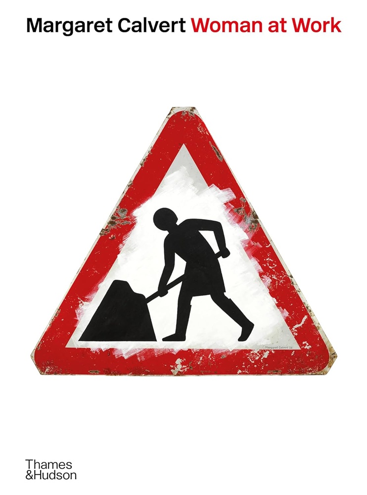 Front cover of soon-to-be-published 'Margaret Calvert: Woman at Work' book, showing a triangular traffic sign showing a woman with a spade in a black mound of undetermined solid matter (earth, concrete, tar?).