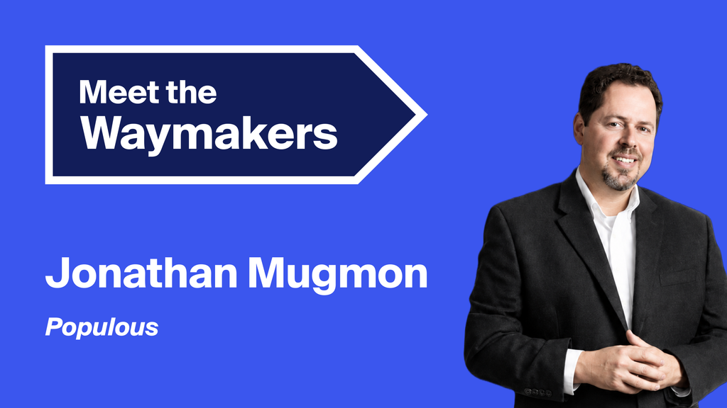 A promotional graphic featuring Jonathan Mugmon of Populous. He stands against a bright blue background wearing a black jacket and white shirt. On the left, a dark blue arrow graphic reads “Meet the Waymakers,” with his name and “Populous” displayed in white text.