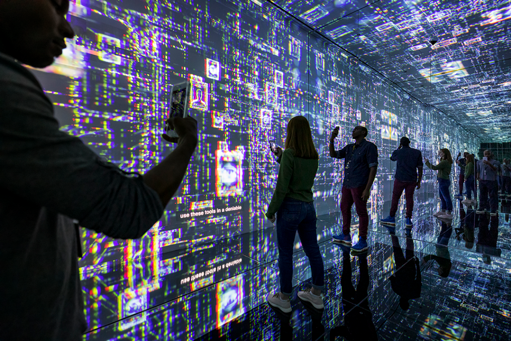 People using mobile phones to read information in a futuristic looking space
