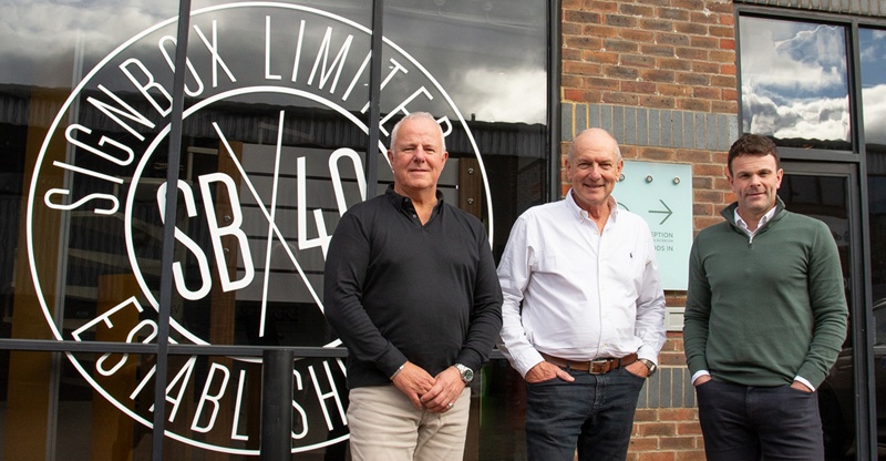 Left to right in front of Signbox building: Matt Wilkins (Signbox Director), Mark Bartlett (MD Signbox), Gareth Livingstone (Stewart Signs MD).