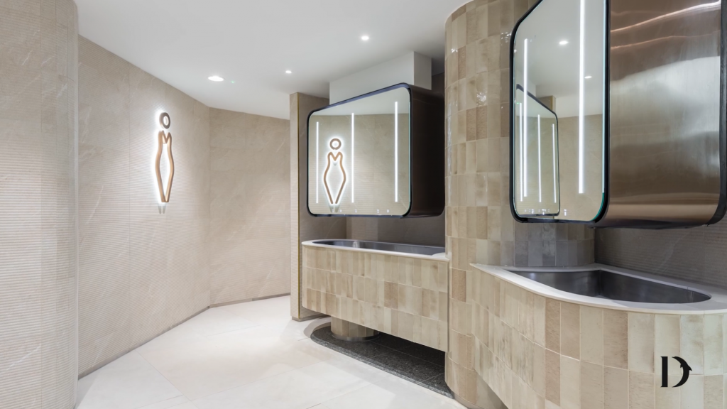 Illuminated women's washroom signage for Westfield Stratford, London (UK) by Signbox