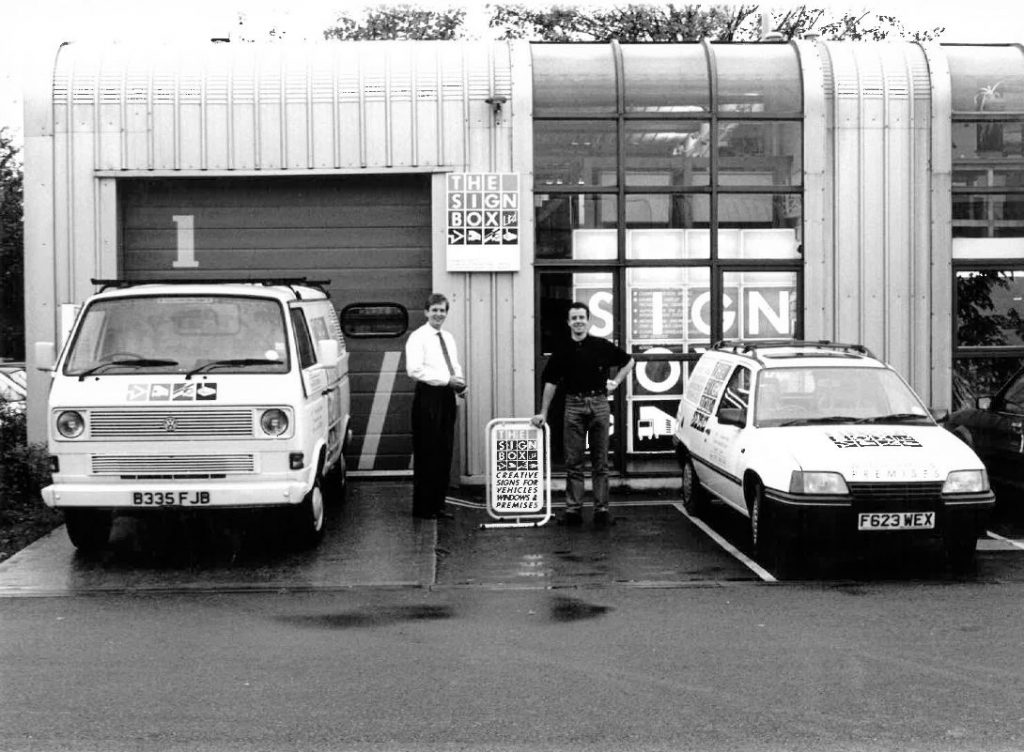 Signbox founders Mark Bartlett and Matt Wilkins outside their company building in the mid 1980s (black and white phohto)
