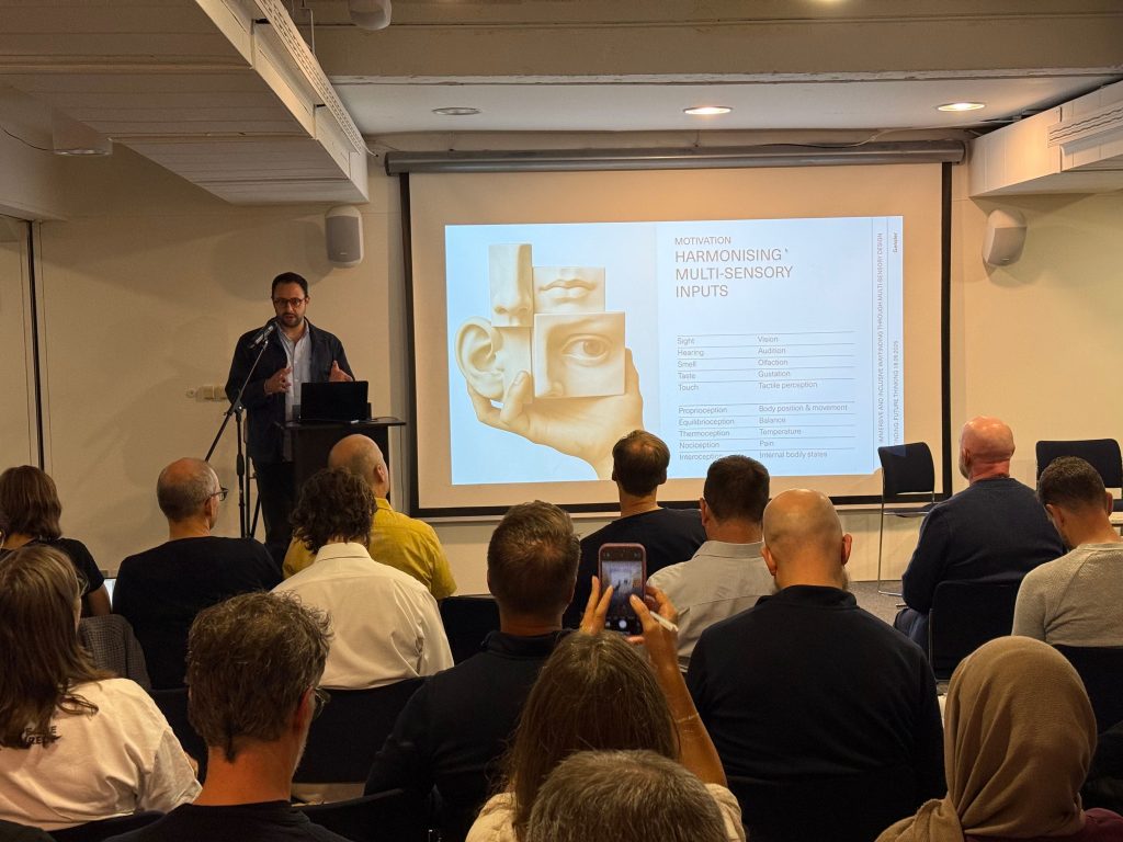 Photo showing SDS & SEGD symposium speaker Angel Sanchez (Gensler) doing his presentation
